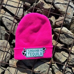 Bright pink beanie with iron on patches